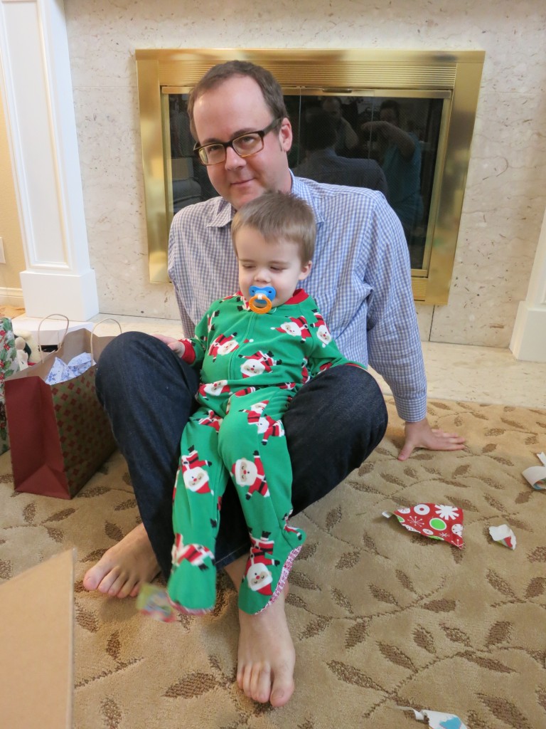 ... and he nearly busts a grin while hanging out with Uncle Chris.