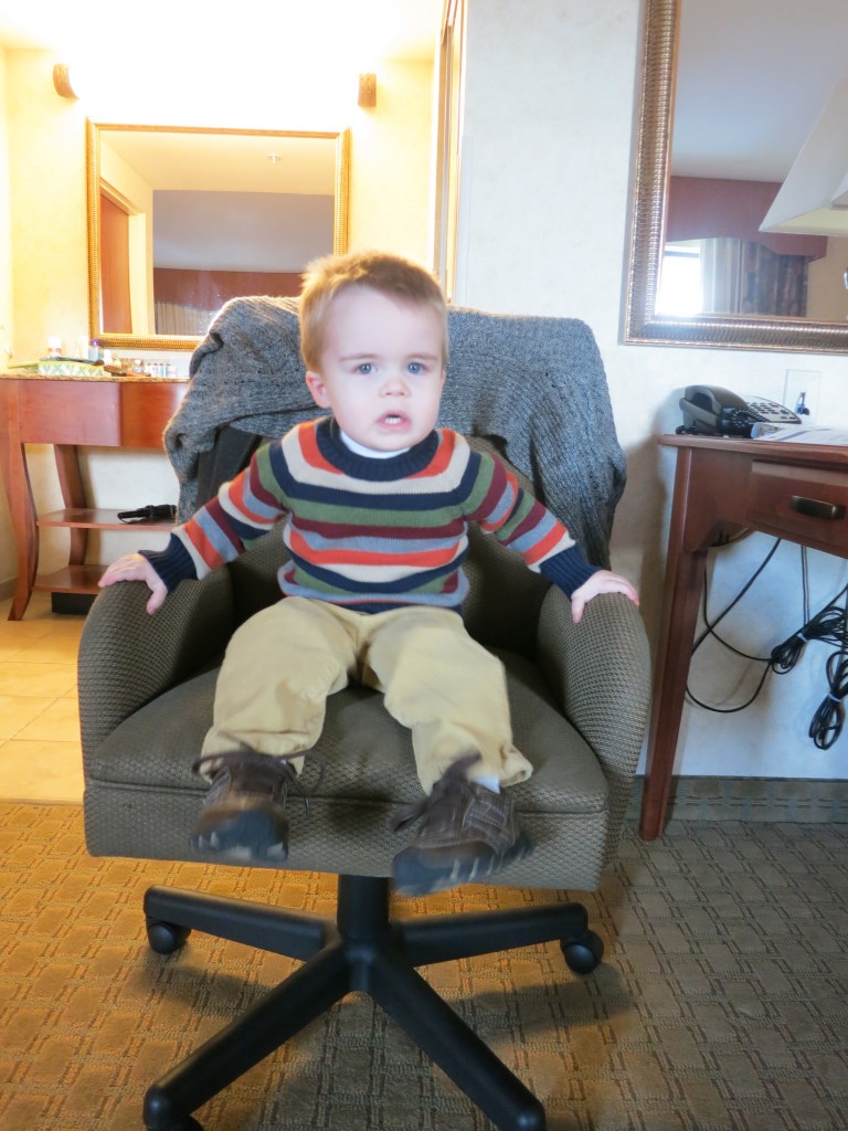 I thought Emrick looked pretty cute in this Fall/Thanksgiving outfit, so I decided to take some pictures of him sitting obediently on the hotel room sofa. It didn't quite work out...