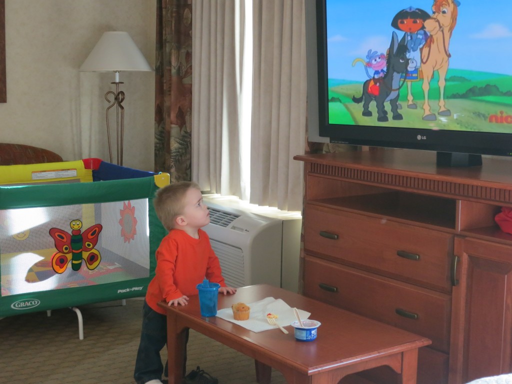 Back at the hotel the next morning, Emrick is entranced by Dora while not eating his continental breakfast. 