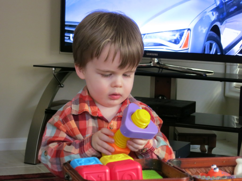 Emrick plays with those toys he had immediately asked for. 