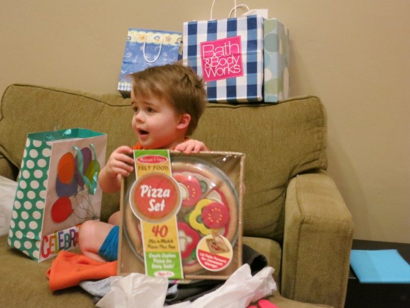 Grandma Sorensen got him a felt pizza set, and he LOVES it.