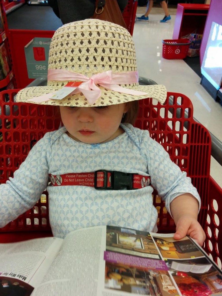 I picked up this hat in Target's dollar section, and Holly loves it. The day we bought it, she grabbed the People Magazine I was browsing in the checkout line, and then proceeded to open it and look at the pages like a grown up. Thank goodness for phone cameras.